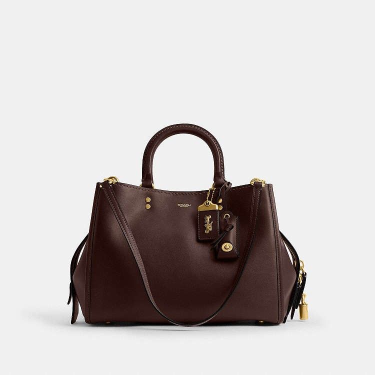 COACH ROGUE 31 in MAPLE (Category: Luxury Bags & Wallets) located in Las Pinas. Submitted by shopwithmira13 (Listing ID 1464194485, Image 1). Description: - Authentic Coach Bag - Elegant Gold Hardware - Versatile Top Handles and Detachable Shoulder Strap - Secure Lock and Key Detail - Spacious Interior for All Your Essentials - Ideal for Everyday Errands or Special Occasions.