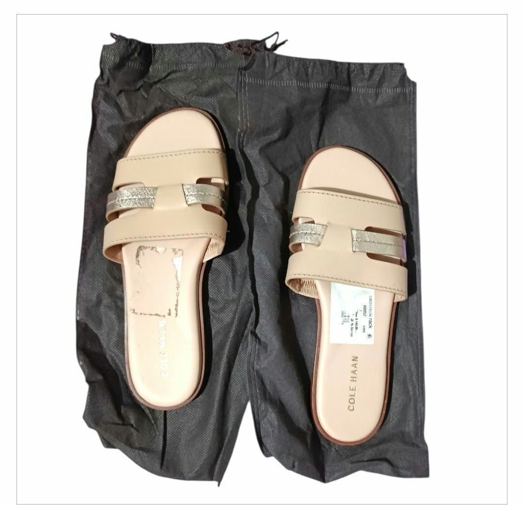 Cole Haan Slides (Category: Slippers and slides) located in Paranaque City. Submitted by calm_youngstore7 (Listing ID 1464328275, Image 1). Description: Cole Haan Women's Flynn Slotted Slide Sandals. This specific pair features a Porcelain / Rose Gold colorway, with a multi-strap fisherman-inspired design combining soft matte straps with metallic gold accents. As shown on the retail tag from Nordstrom Rack, they carry an original manufacturer's s