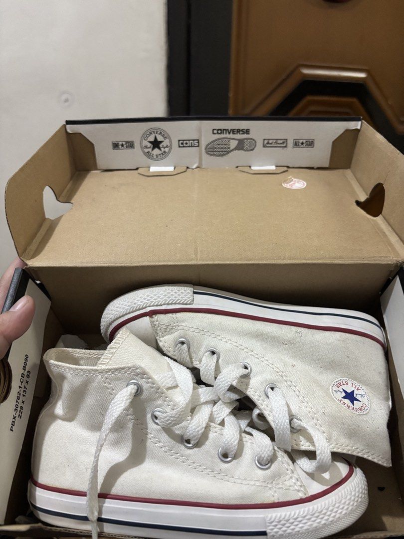 Converse All Star High Top Canvas Shoes (Category: Babies & Kids Fashion) located in Manila. Submitted by dannviz (Listing ID 1464235713, Image 1). Description: - Classic white Converse high tops - Includes original box - White laces - Red and blue stripe detail on the sole - Ideal for everyday wear.