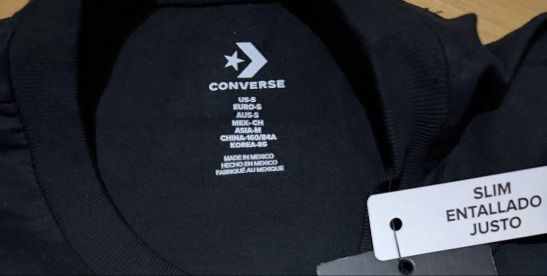 Converse Women's Black Shirt Small - Medium (Category: Shirts) located in Quezon City. Submitted by beckyshop2024 (Listing ID 1464343184, Image 2). Description: - Brand new - Original from US - Runs big, S on tag, fits up to Medium.