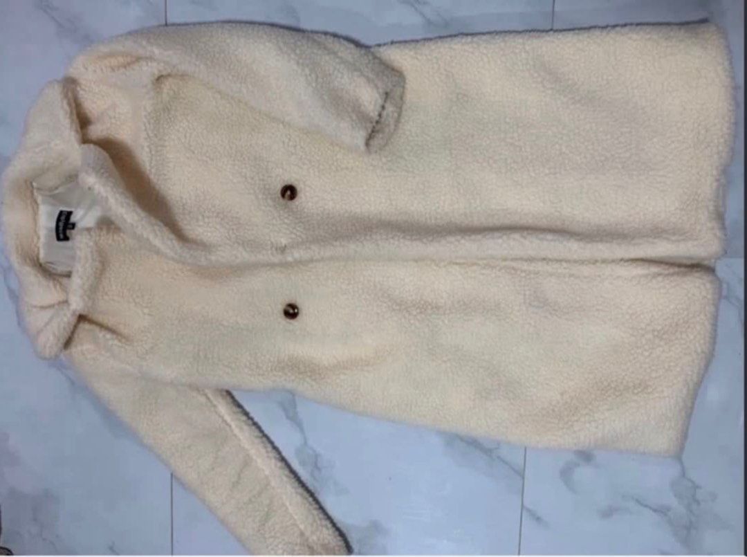 Cream Teddy Coat Double Breasted (Category: Coats, Jackets and Outerwear) located in Manila. Submitted by decluterthings888 (Listing ID 1464337400, Image 1). Description: - Cream colored teddy coat - Double-breasted style with two buttons - Mid-length - Super cozy and warm - Great for cooler weather - Easy to style with anything.
