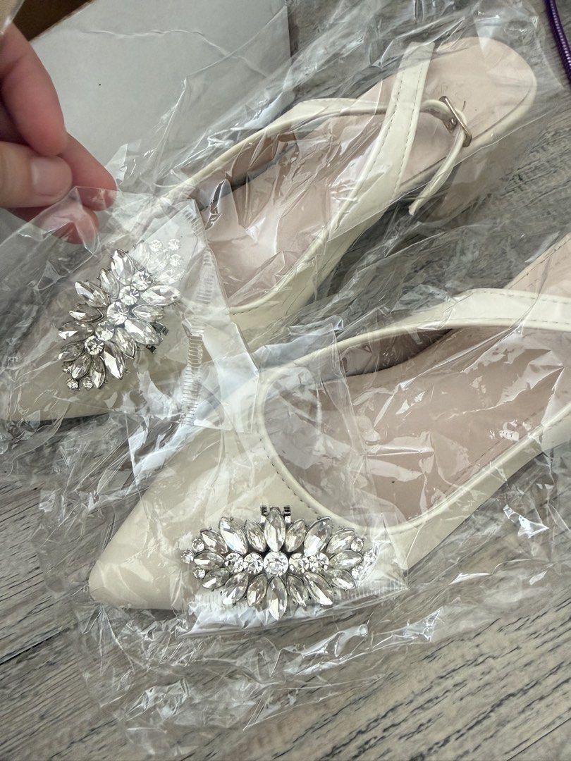 Cream White Bridal Heels (Category: Heels) located in Bulacan. Submitted by itsmsks (Listing ID 1464158558, Image 3). Description: - Cream slingback heels - Pointed toe design - Adjustable buckle strap at the heel - free Detachable rhinestone embellishment for extra sparkle - Ideal for elevating any outfit - Sold as a pair -free sole foam .