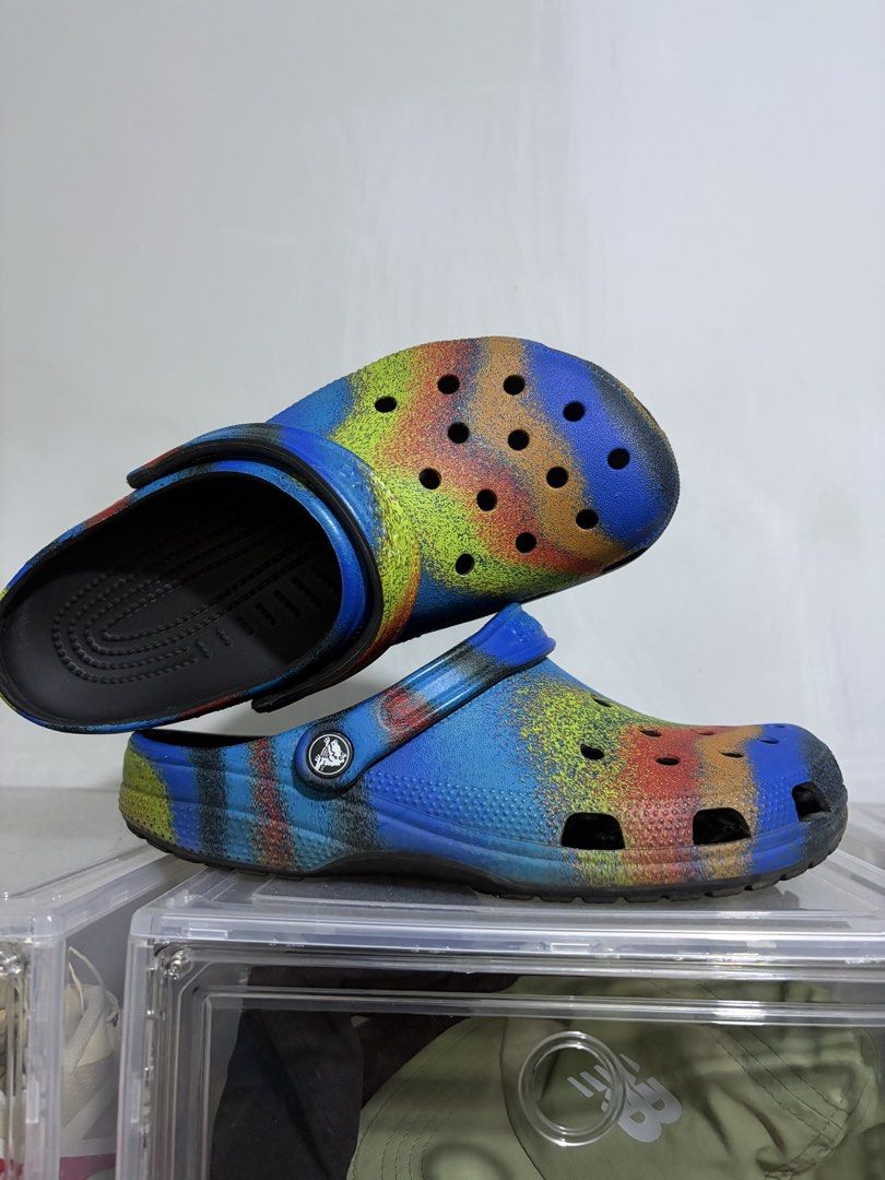 Crocs Classic Clog Tie Dye Spray Paint (Category: Slippers & Slides) located in Pasig City. Submitted by otitcram (Listing ID 1464318663, Image 1). Description: - Classic clog style Crocs - Unique tie-dye spray paint design - Blue base with yellow, orange, and red accents - Features holes for Jibbitz charms - Ideal for everyday casual wear 📍Pasig.