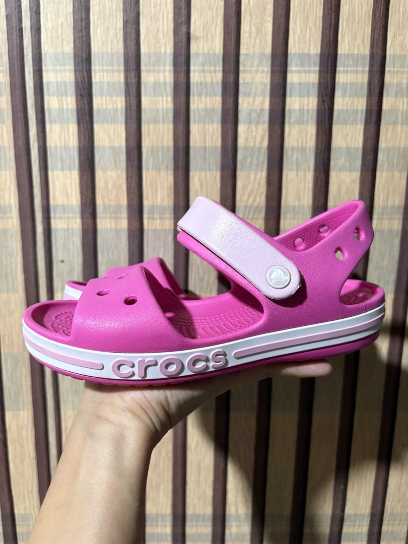 Crocs Pink Sandals Size J1 (Category: Babies & Kids Fashion) located in Cavite. Submitted by -coffeebean- (Listing ID 1464173297, Image 2). Description: - Pink Crocs sandals for kids - Size J1 - 20cm - Easy slip-on design - Adjustable straps for a secure fit - Ideal for everyday wear and outdoor activities - Soles with good grip for safety - Lightly used, outgrown quickly - bought in Taiwan.