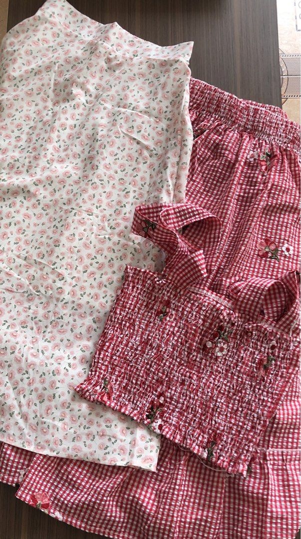 Cute Gingham & Floral Pajama Set (Category: Undergarments & Loungewear) located in Manila. Submitted by ellegab2 (Listing ID 1464190423, Image 1). Description: - Sweet pajama set - Red gingham pattern - Floral print top with smocking detail for comfort - High-waisted bottoms with drawstring - Perfect for lounging at home - Made with soft fabric - Floral skirt : 100php - top and skirt coordinates: 150.
