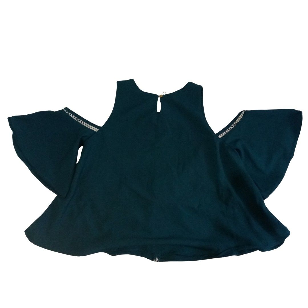 Dark Teal Cold Shoulder Bell Sleeve Top (Category: Sleeveless) located in Baguio. Submitted by tequilamojito (Listing ID 1464265680, Image 2). Description: - Dark teal top - Cold shoulder design - Flowy bell sleeves - White trim detail on sleeves and front - Keyhole closure at the back of the neck - Suitable for casual or dressy occasions.