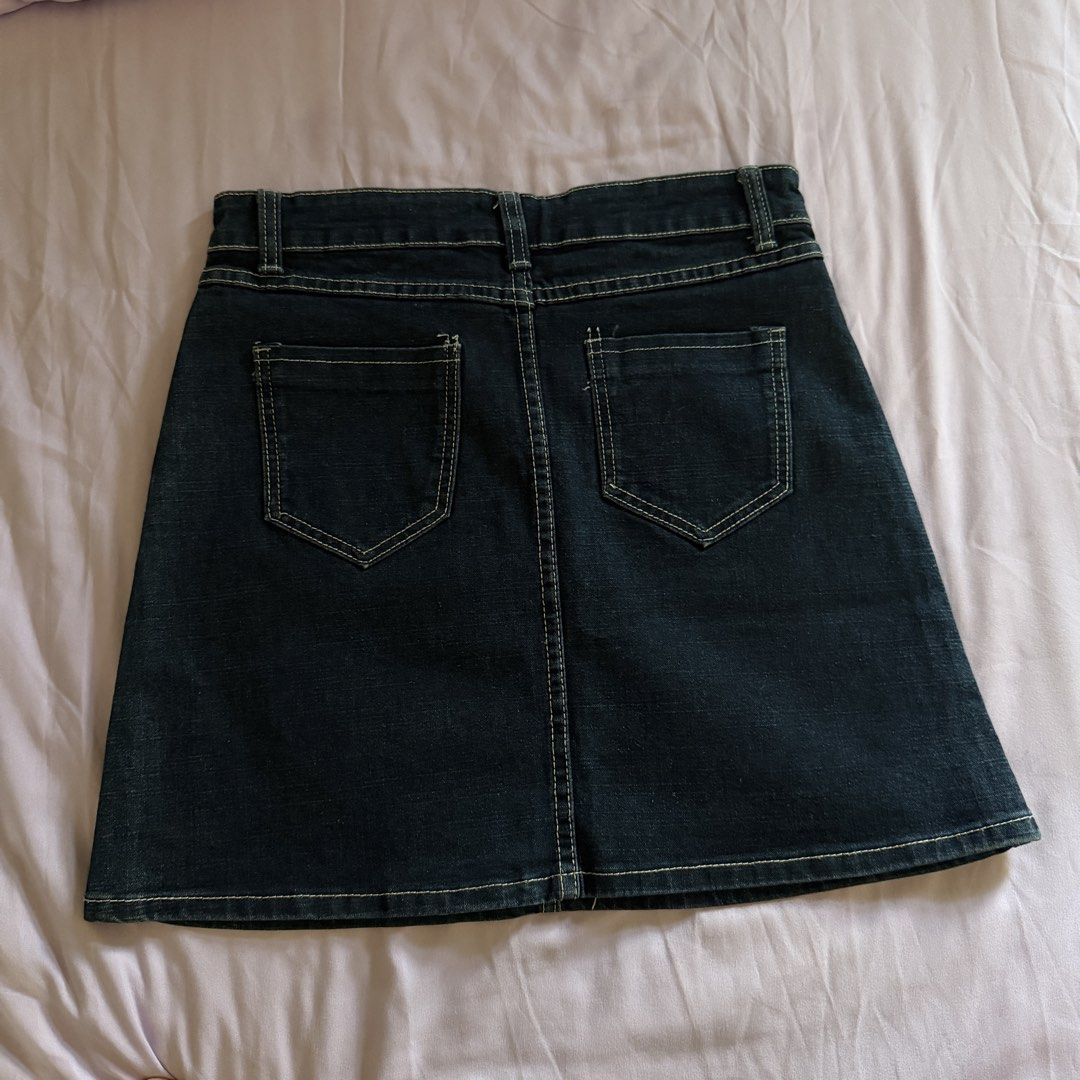 Dark Wash Denim A-Line Mini Skirt (Category: Skirts) located in Manila. Submitted by dyjamie (Listing ID 1464218237, Image 2). Description: - Dark wash denim mini skirt - Flattering A-line cut - Two front pockets with distressed detailing - Secure button and zip closure - Back pockets included - Perfect for casual outfits - Waist measures approximately 14 inches across.