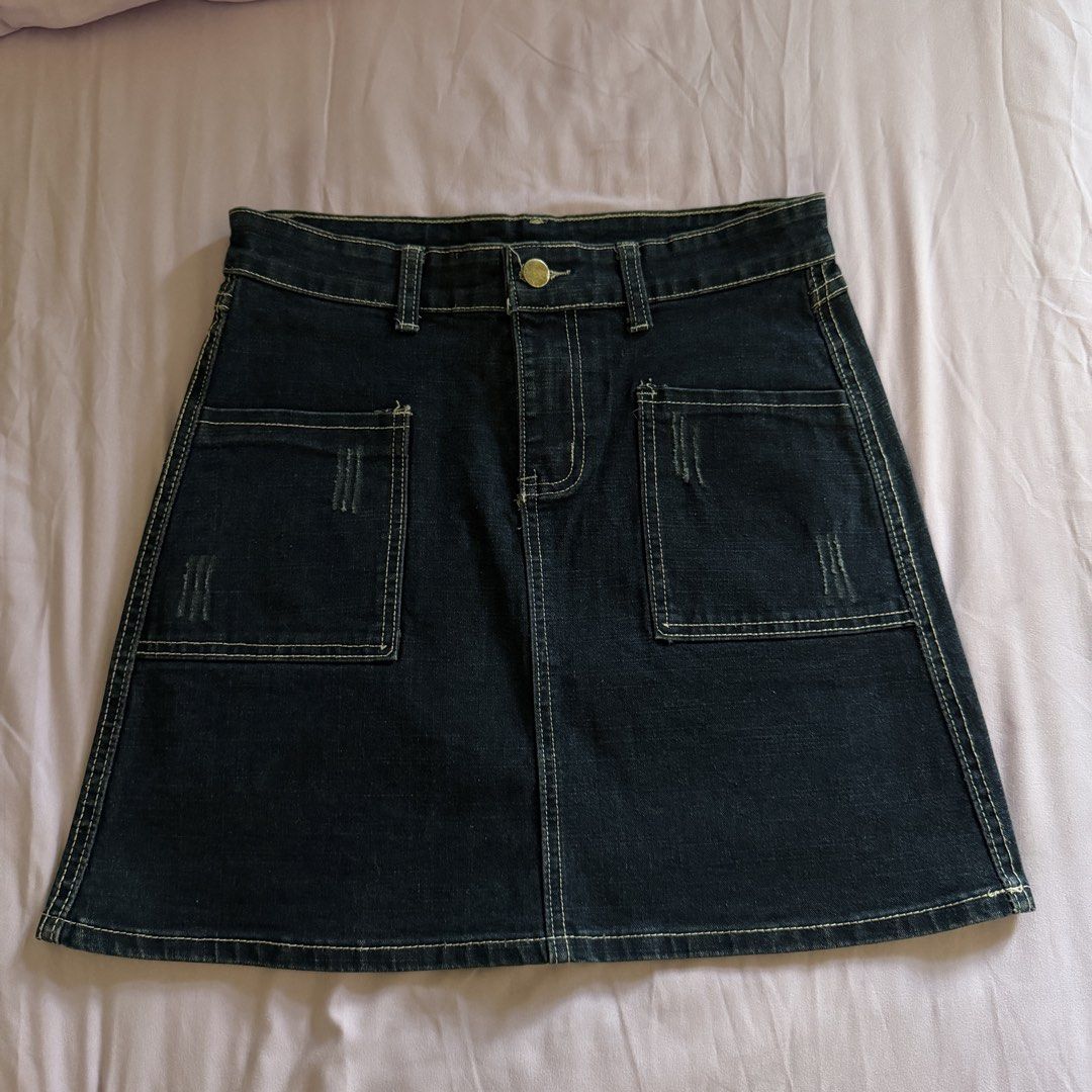 Dark Wash Denim A-Line Mini Skirt (Category: Skirts) located in Manila. Submitted by dyjamie (Listing ID 1464218237, Image 1). Description: - Dark wash denim mini skirt - Flattering A-line cut - Two front pockets with distressed detailing - Secure button and zip closure - Back pockets included - Perfect for casual outfits - Waist measures approximately 14 inches across.