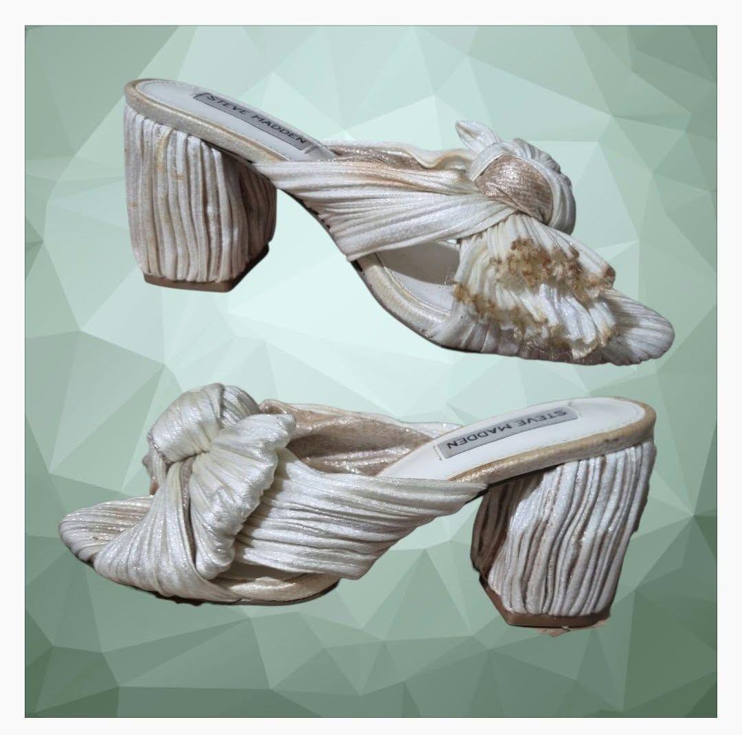 Steve Madden Deacon Knot Block Heeled Sandal (Category: Sandals) located in Paranaque City. Submitted by calm_youngstore7 (Listing ID 1464322466, Image 3). Description: Deacon Knot Slide Sandal In Metallic Ivory with ombre chrome edges Puckered, crinkled fabric brings modern texture to a party-ready sandal shaped with a wrapped column heel and an artfully knotted bow over the toe. Textile upper/synthetic lining and sole Imported Steve Madden Deac