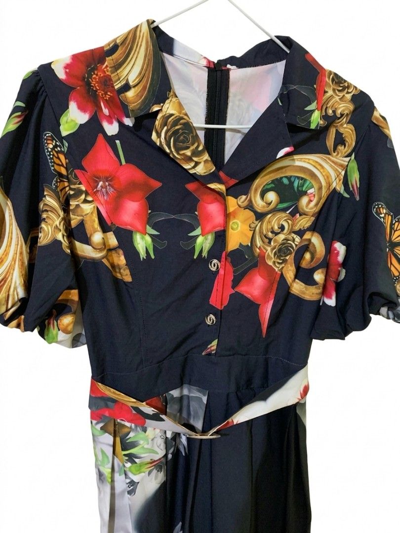 Decluttering BKK dress (Category: Dresses) located in Quezon City. Submitted by ollieollie01 (Listing ID 1464301642, Image 2). Description: - Bold black maxi dress - Eye-catching floral and baroque print - Stylish puff sleeves - Classic collared neckline - Includes a matching belt to define your waist - Flowy, pleated skirt - Ideal for a standout outfit.
