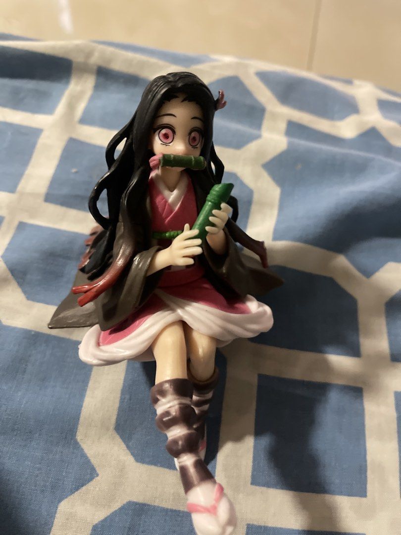 Demon Slayer Nezuko Kamado Figure (Category: Figurines & Statues) located in Cabanatuan. Submitted by nathaniel_ang (Listing ID 1464233250, Image 1). Description: - Nezuko Kamado figure from the popular anime Demon Slayer. - Features her signature bamboo muzzle. - Intricate details on her kimono and hair. - Comes with a display base for easy showcasing. - A must-have for any anime fan's collection..