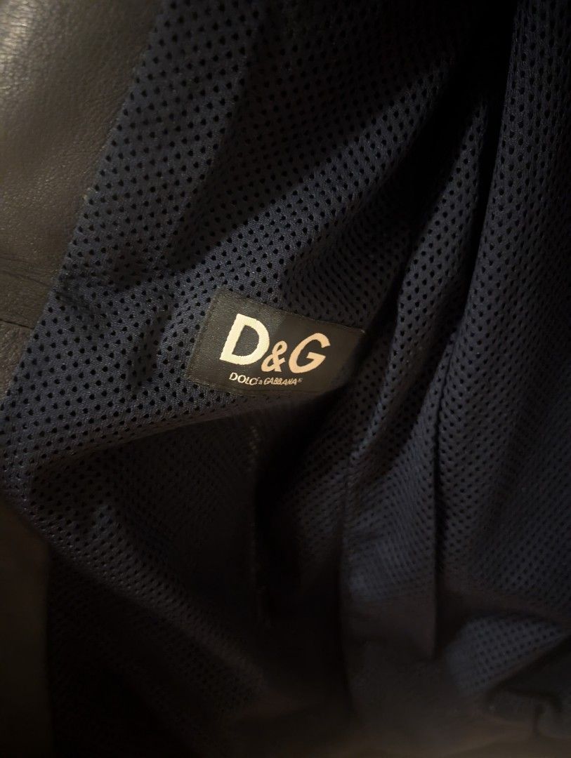 D&G Dolce & Gabbana Leather Bomber Jacket (Category: Luxury Apparel) located in Manila. Submitted by seanapaul (Listing ID 1464206006, Image 2). Description: - Authentic D&G Dolce & Gabbana leather retro jacket - Racing-inspired design with red, white, and blue accent - Breathable mesh inner lining - D&G logo patch on chest - 'Around The World' detail on the back - Ideal for a stylish, casual outfit Pick up BGC or MoA.