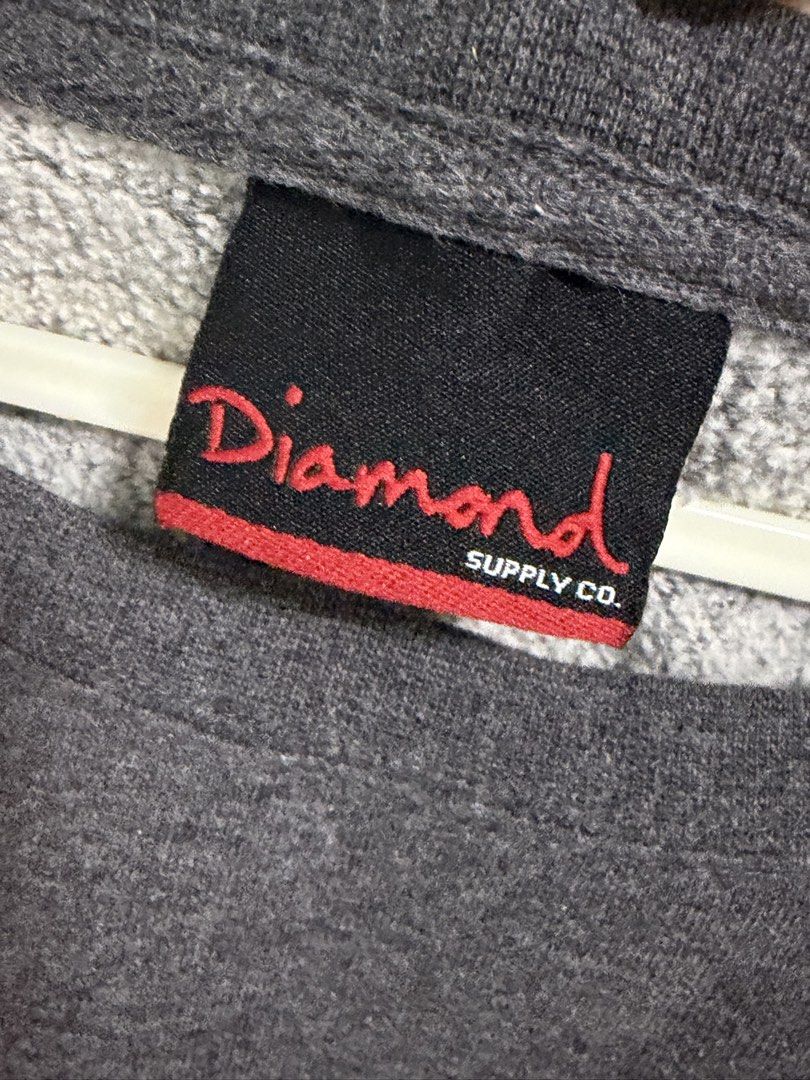 Diamond Supply Co. Grey Crewneck Sweatshirt (Category: Coats, Jackets and Outerwear) located in Manila. Submitted by bright.xoxoapple (Listing ID 1464351849, Image 2). Description: - Brand: Diamond Supply Co. - Type: Grey Crewneck Sweatshirt - Design: Features the classic Diamond Supply Co. logo on the front - Comfort: Comfortable and casual fit - Occasion: Ideal for everyday wear.