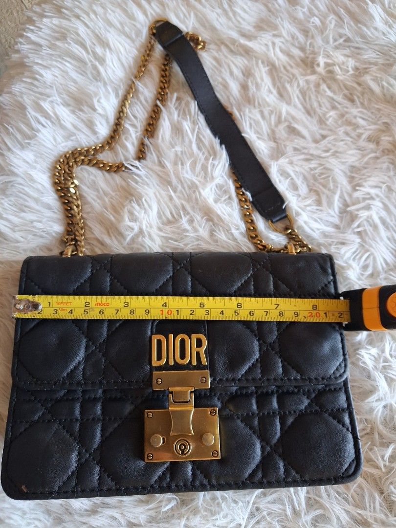 Dior Quilted Black Leather Chain Shoulder Bag (Category: Cross-body Bags) located in Agoncillo. Submitted by vinsoy07 (Listing ID 1464140964, Image 2). Description: - Black quilted leather Dior bag - Gold chain strap and hardware - Iconic Dior clasp - Approximately 7 inches wide - Ideal for evenings or adding luxury to daily wear - Spacious interior for essentials.