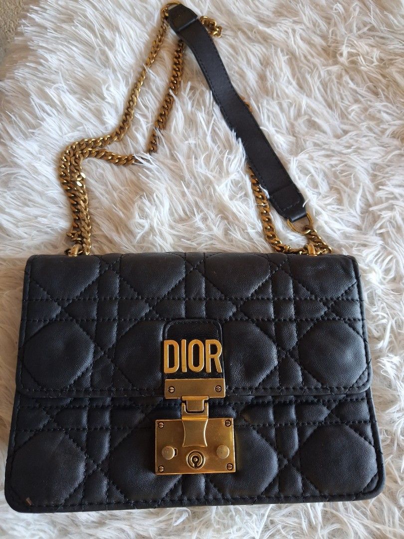 Dior Quilted Black Leather Chain Shoulder Bag (Category: Cross-body Bags) located in Agoncillo. Submitted by vinsoy07 (Listing ID 1464140964, Image 1). Description: - Black quilted leather Dior bag - Gold chain strap and hardware - Iconic Dior clasp - Approximately 7 inches wide - Ideal for evenings or adding luxury to daily wear - Spacious interior for essentials.