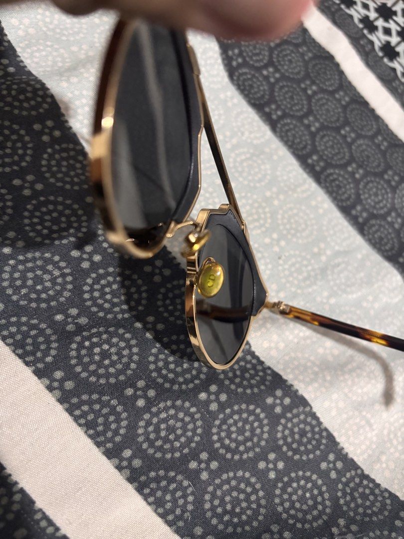 Dior So Real Sunglasses (Category: Sunglasses & Eyewear) located in Trece Martires City. Submitted by kenzolois2004 (Listing ID 1464241103, Image 3). Description: - Authentic Dior So Real sunglasses - Chic black lenses with a sleek gold frame - Stylish tortoiseshell arms for a unique touch - Modern and fashionable design - Ideal for protecting your eyes on sunny days - Comes with the original Dior case.