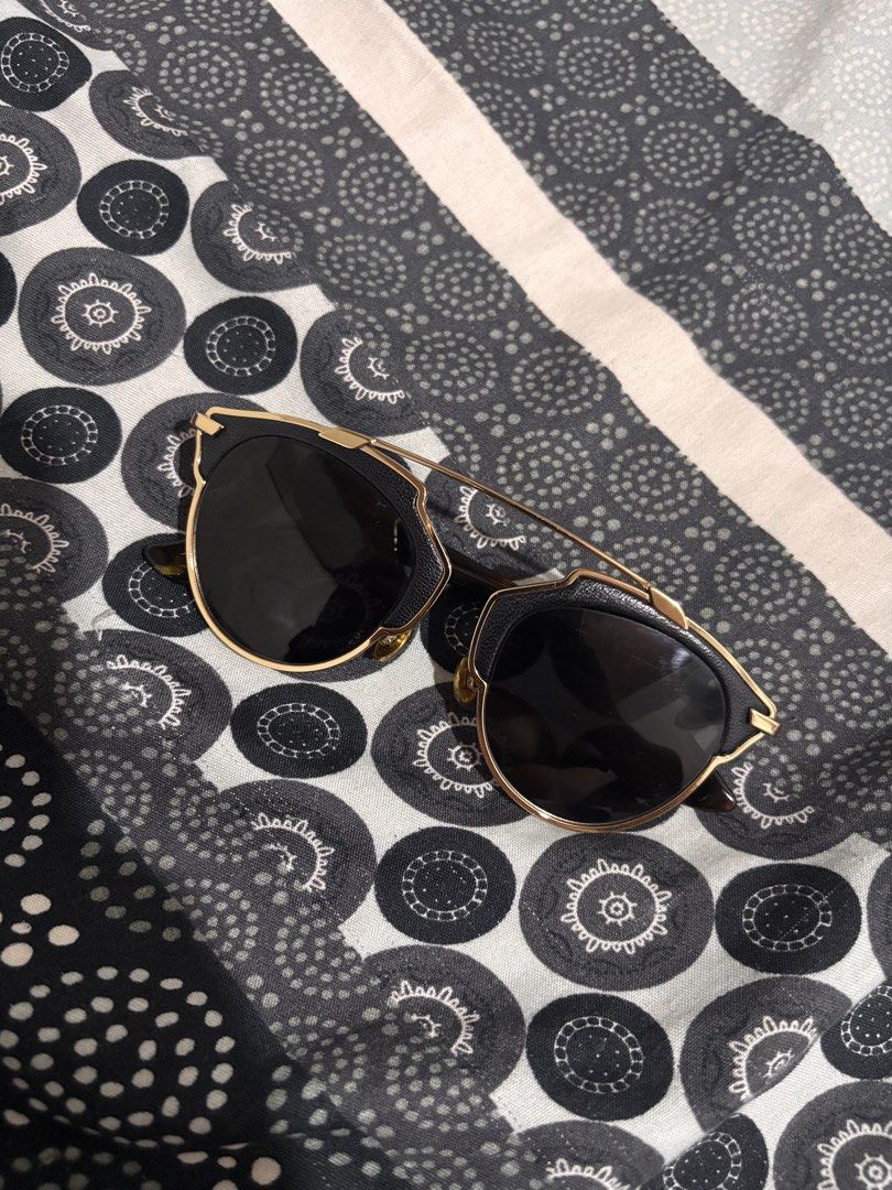 Dior So Real Sunglasses (Category: Sunglasses & Eyewear) located in Trece Martires City. Submitted by kenzolois2004 (Listing ID 1464241103, Image 2). Description: - Authentic Dior So Real sunglasses - Chic black lenses with a sleek gold frame - Stylish tortoiseshell arms for a unique touch - Modern and fashionable design - Ideal for protecting your eyes on sunny days - Comes with the original Dior case.