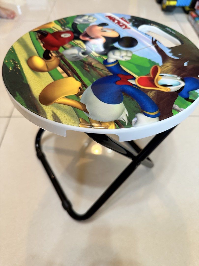 Disney Mickey Donald Duck Folding Stool (Category: Character Goods) located in Manila. Submitted by silver.truemountain (Listing ID 1464164241, Image 3). Description: - Adorable Disney stool featuring Mickey and Donald Duck. - Colorful graphic seat. - Folds flat for convenient storage. - Portable with a handle for easy carrying. - Ideal for kids' use or as a small accent seat. - Perfect for picnics, indoor, or outdoor use..