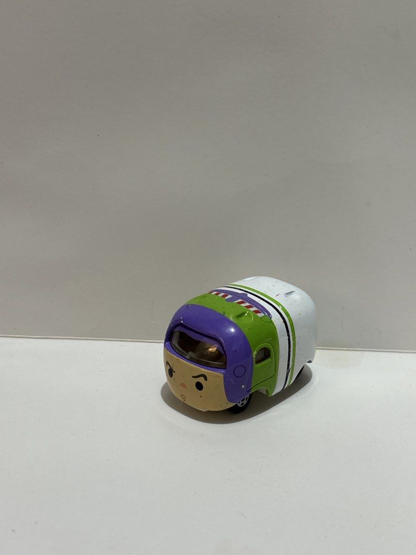 Disney Pixar Buzz Lightyear Tomica Car Toy (Category: Vehicle & Diecast Models) located in Cavite. Submitted by eleanordc (Listing ID 1464310955, Image 1). Description: - Buzz Lightyear Tsum Tsum car - White with green and purple accents - Features wheels - Small toy, suitable for display or play - Shows minor scuffs on the white surface - Ideal for any Toy Story enthusiast.