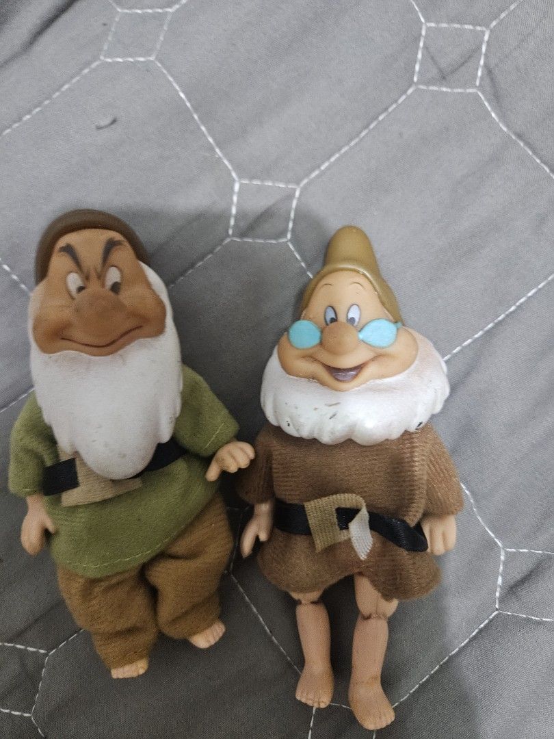 Disney Snow White Dwarf Figurines Set (Category: Figurines & Statues) located in Tarlac. Submitted by dhiyanatividad (Listing ID 1464255365, Image 1). Description: - Authentic Disney Snow White dwarf figurines - One dwarf: brown outfit, blue glasses - Second dwarf: green top, brown pants - Features soft fabric clothing - Durable plastic limbs - Ideal for Disney collectors - Fun toy for kids.