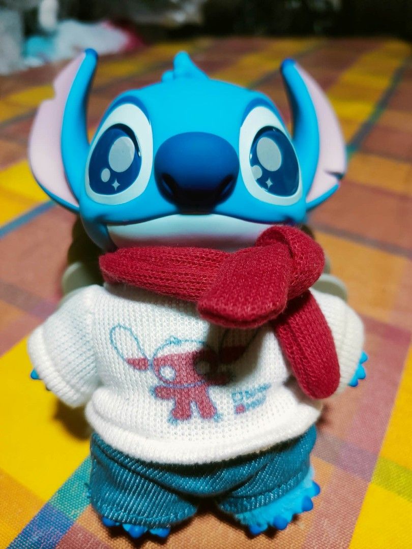 Disney Stitch Hard figure (Category: Designer & Blind Box Toys) located in Manila. Submitted by jhs31 (Listing ID 1464184626, Image 1). Description: - Stitch hard figure - Dressed in a white sweater and blue shorts - Features a vibrant red scarf - "Disney Top Toy" branding on the feet - Ideal for Stitch enthusiasts and collectors - Perfect for desk or shelf display -SELLING AS IS -CROSSPOSTED.