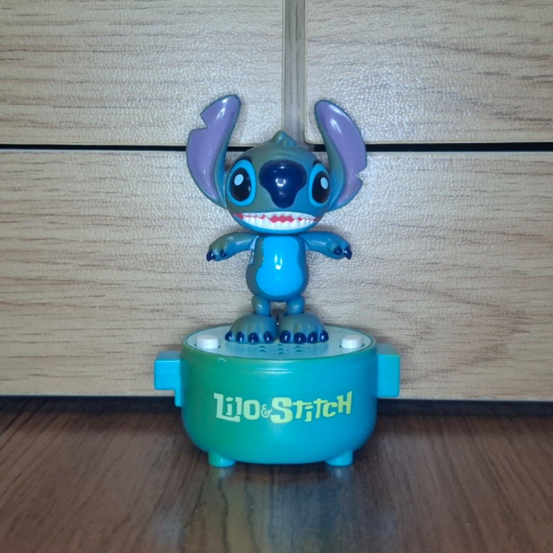 Disney Stitch Little Taps (Lilo & Stitch) (Category: Interactive Toys) located in Andop. Submitted by butterham (Listing ID 1464302177, Image 1). Description: ❗️LAST PRICE❗️(Slightly Negotiable) 📌 Bundle discounts available for orders with multiple items (Combined shipping available). 🩵 Condition: • Working (Taps well) • Has Very Little Sound • Requires three LR44 batteries • Better as a collectible than a functional toy • Has sun damage & fadi