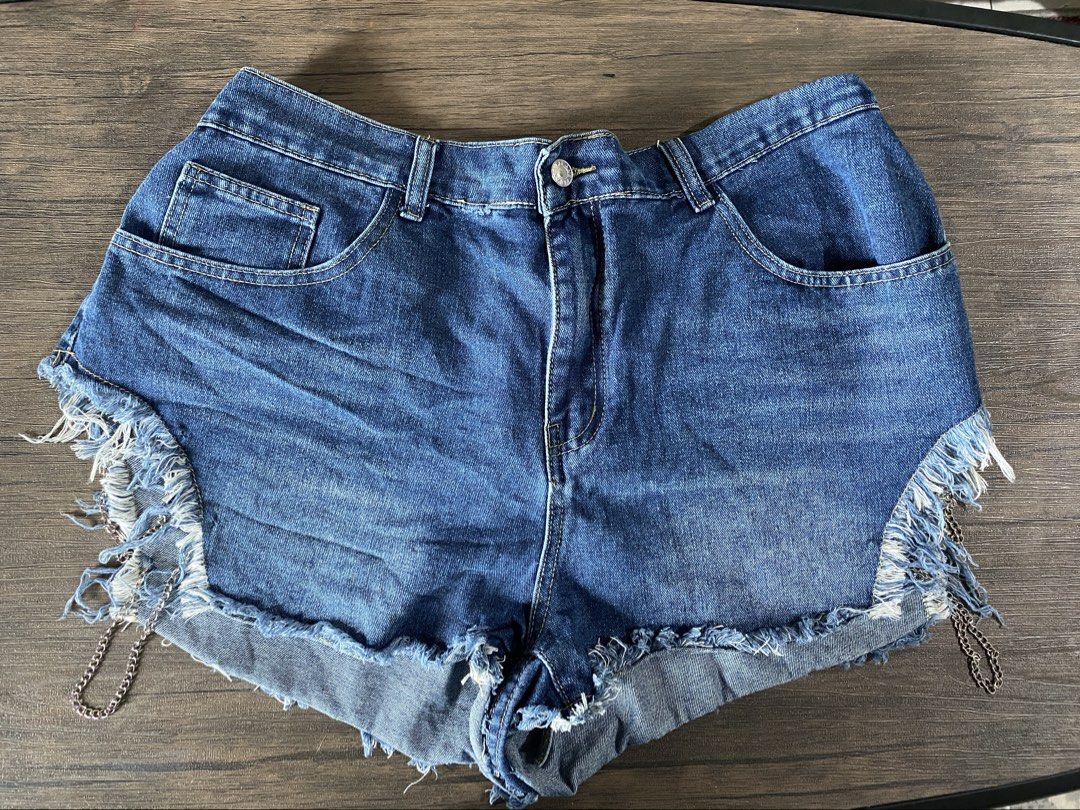 Distressed Denim Shorts with Frayed Hem (Category: Shorts) located in Quezon City. Submitted by jiujitsu_la (Listing ID 1464167039, Image 2). Description: - Cute denim shorts with a frayed hem. - Features distressing and rips for an edgy look. - Available in blue denim and white. - Ideal for casual wear. - Pairs well with t-shirts or crop tops. Php 250 each, take all 3 for Php 500.