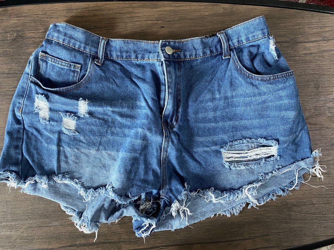 Distressed Denim Shorts with Frayed Hem (Category: Shorts) located in Quezon City. Submitted by jiujitsu_la (Listing ID 1464167039, Image 3). Description: - Cute denim shorts with a frayed hem. - Features distressing and rips for an edgy look. - Available in blue denim and white. - Ideal for casual wear. - Pairs well with t-shirts or crop tops. Php 250 each, take all 3 for Php 500.