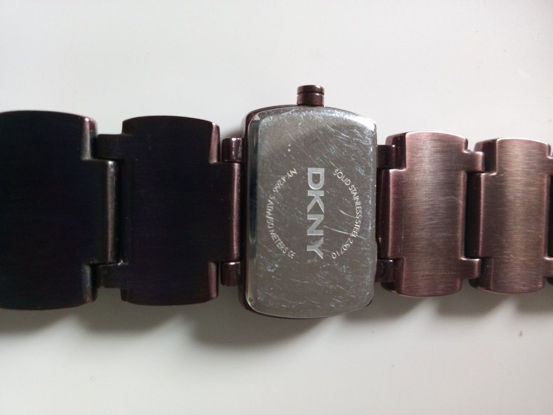 DKNY Rectangular Watch with Brown Stones (Category: Women's Watches) located in Malolos. Submitted by lizarondoe59660 (Listing ID 1464292373, Image 3). Description: - Brand: DKNY - Face Shape: Rectangular - Band Details: Rectangular brown stones - Case Material: Solid Stainless Steel Back - Good condition - No issue and No inclusions - Free shipping!.