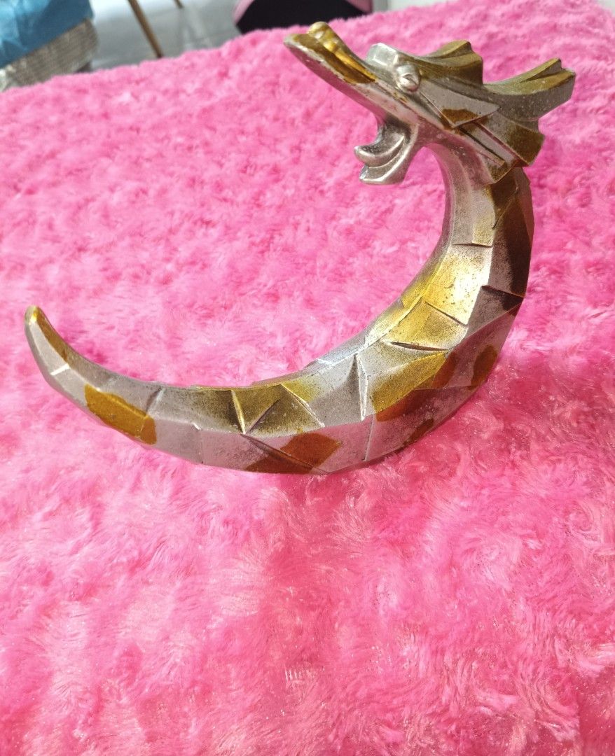 Dragon Crescent Moon Figurine Sculpture Decor (Category: Figurines & Statues) located in Pasay City. Submitted by ynamariie (Listing ID 1464204733, Image 1). Description: - Unique Dragon Crescent Moon Sculpture - Metallic Silver and Gold Finish - Geometric, Faceted Design - Perfect for Display or Desk Ornament - Approximately 7 Inches Long.