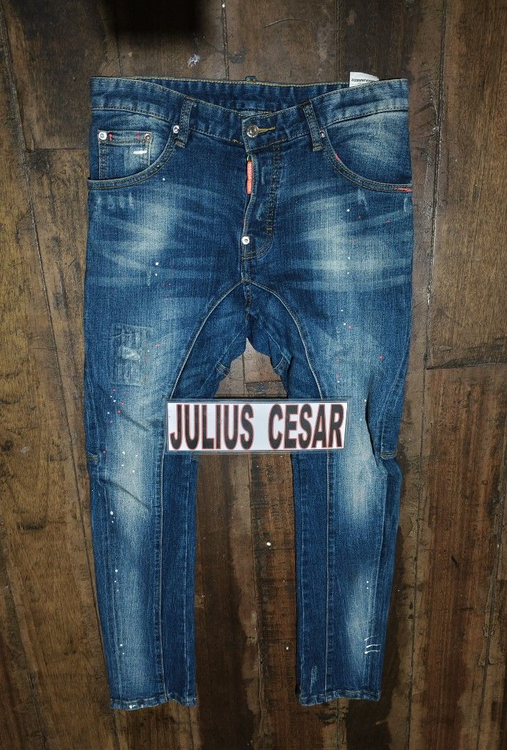 DSQUARED2 Distressed Wash Button Fly Jeans (Category: Jeans) located in Baguio. Submitted by thriftjc (Listing ID 1464180875, Image 2). Description: - DSQUARED2 Jeans - Size 30-32 actual waistline - Distressed wash with paint splatters and ripped details - Unique stitching and paneling - Button fly closure with bright neon green buttons - Bold statement piece.