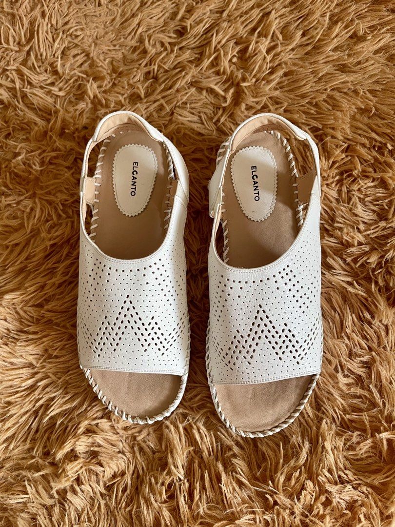 ELCANTO White Perforated Slingback Wedge Sandals (Category: Flats & Sandals) located in Quezon City. Submitted by donnieg-227 (Listing ID 1464274143, Image 1). Description: - Brand: ELCANTO - Color: White - Style: Slingback sandals - Features: Perforated front strap, elastic slingback strap for secure fit, comfortable wedge heel - Occasion: Casual wear or dressing up.