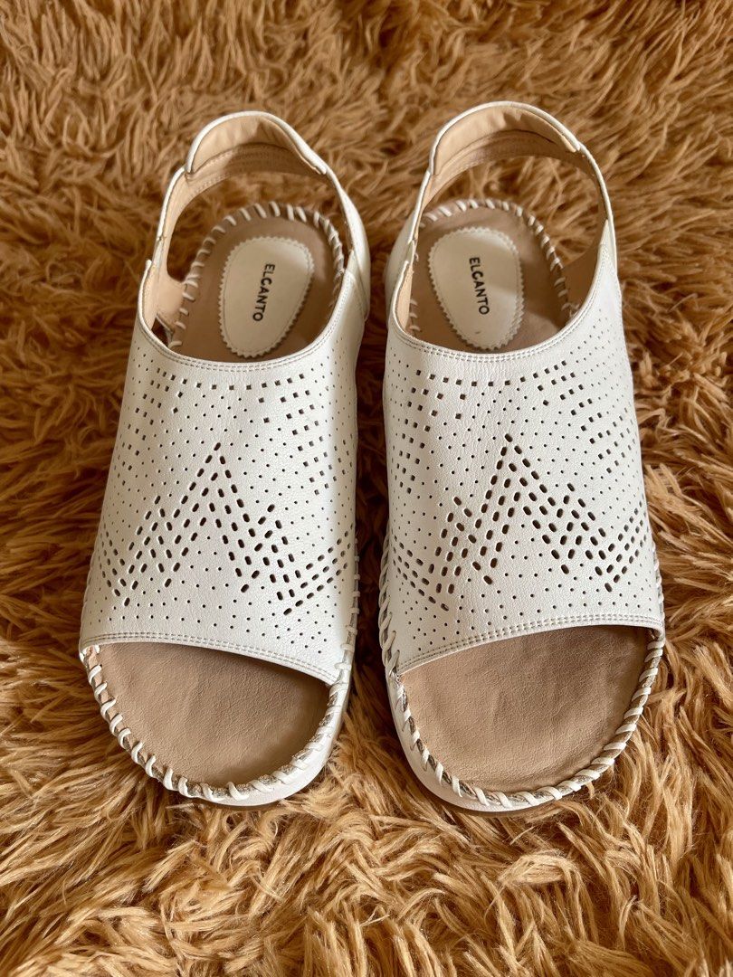 ELCANTO White Perforated Slingback Wedge Sandals (Category: Flats & Sandals) located in Quezon City. Submitted by donnieg-227 (Listing ID 1464274143, Image 3). Description: - Brand: ELCANTO - Color: White - Style: Slingback sandals - Features: Perforated front strap, elastic slingback strap for secure fit, comfortable wedge heel - Occasion: Casual wear or dressing up.