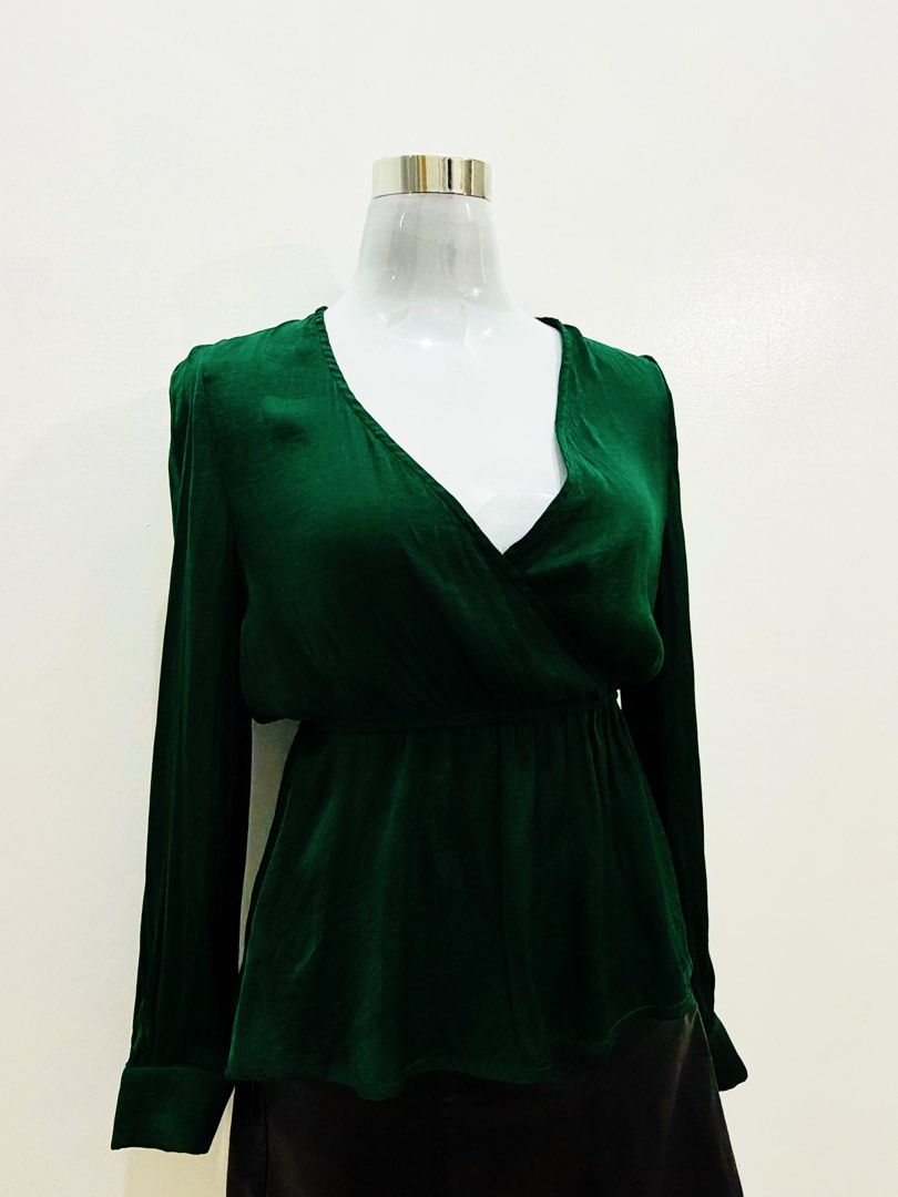 Emerald Green Satin Wrap Long Sleeve Blouse (Category: Blouses) located in Manila. Submitted by e.louise (Listing ID 1464333160, Image 2). Description: - Beautiful emerald green satin blouse - Flattering wrap front design - Long sleeves with button cuffs - Luxurious fabric with a lovely sheen - Comfortable elasticated waist - Versatile for dressing up or down.
