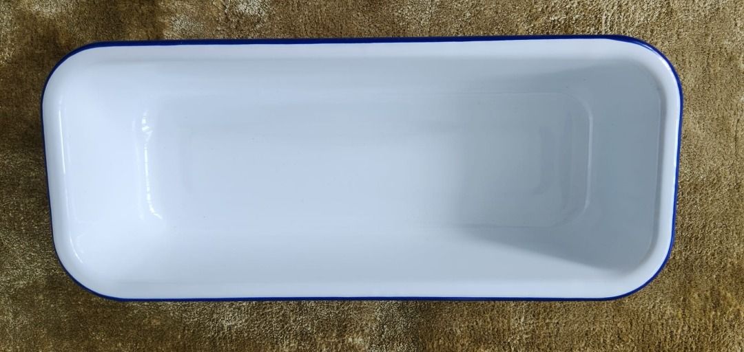 Enamel Rectangular Baking Tin (Category: Bakeware) located in Singapore. Submitted by openkit (Listing ID 1464146892, Image 1). Description: - Brand: Tchibo - Type: Rectangular baking tin - Material: Ovenproof metal enamel (corrosion-resistant) - Ideal for: Bread, terrines, loaf cakes, savoury & sweet dishes - Dimensions: Approx. 32cm (L) x 7cm (W) x 13cm (H) - Capacity: Approx. 1.9 Litres.