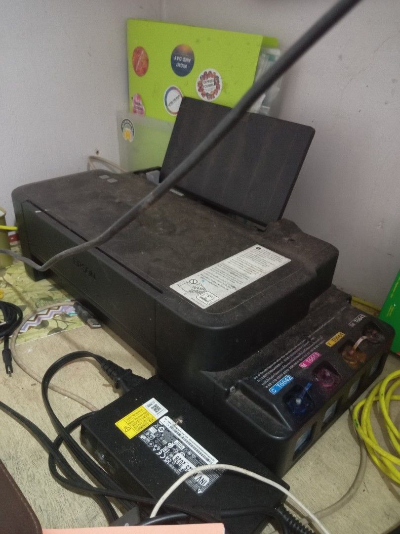 Epson L120 (Category: Printers, Scanners & Copiers) located in Taguig. Submitted by mhaneou (Listing ID 1464240517, Image 1). Description: well used for many years, been using this for merch making and personal use. has some lines when printed; some head cleaning and maintenance will do to maintain clean lines. doesn't have time to do such anymore. comes with extra inks as freebies. Location: Taguig MOP: Maya/Maribank MOD: JnT/lbc/same day delive