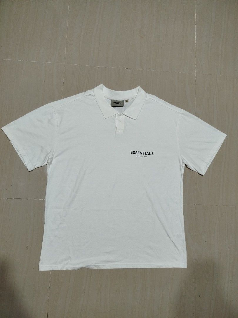 Essentials FOG polo shirt (Category: Tshirts & Polo Shirts ) located in Aroroy. Submitted by dr0p-a-dr1p (Listing ID 1464207948, Image 1). Description: Width: 23 Length: 29 - Brand: Fear of God Essentials - Color: White - Size: Large (L) - Style: Short sleeve polo shirt - Features: Collar, button placket, subtle chest logo - Origin: Made in Vietnam - Occasion: Ideal for casual wear.
