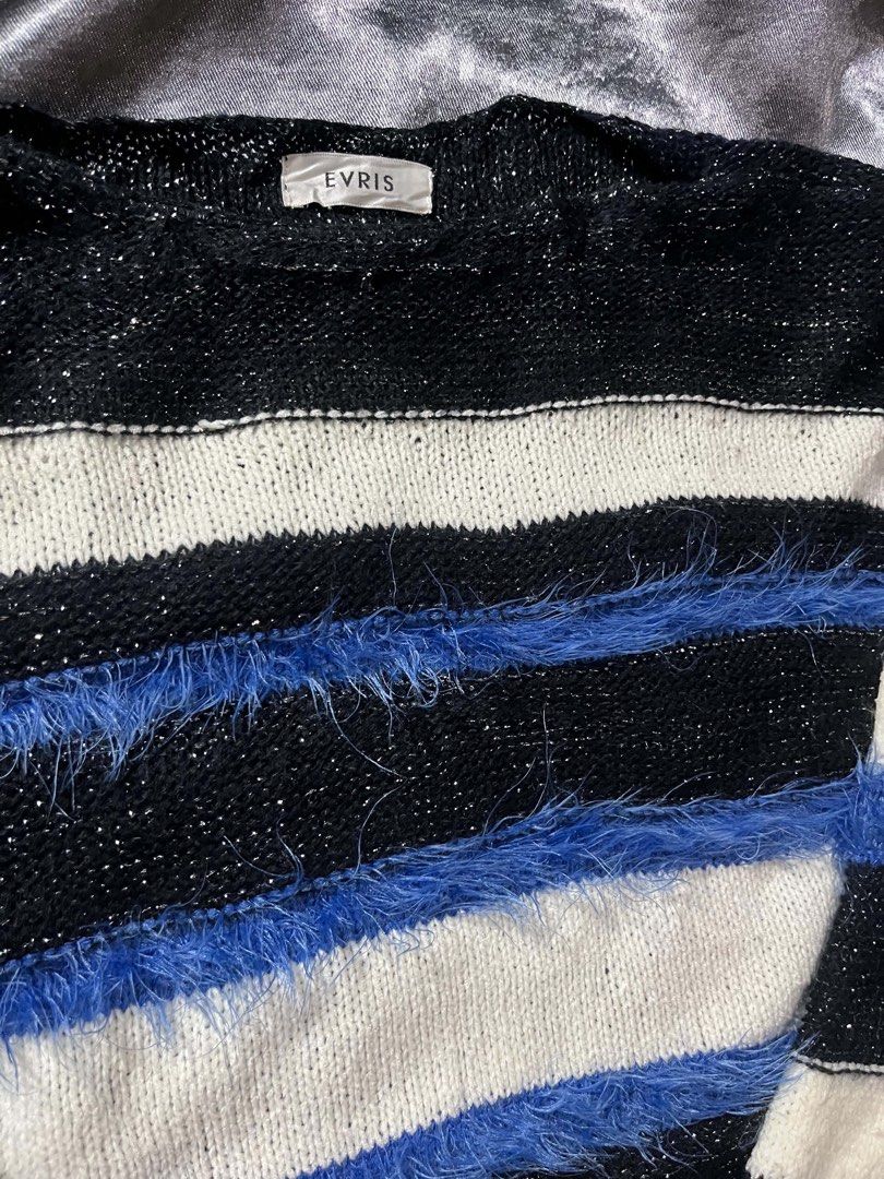 EVRIS Striped Fuzzy Knit Sweater (Category: Coats, Jackets and Outerwear) located in General Trias. Submitted by kevinthriftshop (Listing ID 1464279518, Image 3). Description: - Black, white, and blue striped knit sweater - Fuzzy blue accents on sleeves and body - Sparkly threads woven into black stripes - Crew neck, long sleeves - Super cozy and unique design - Ideal for layering or wearing solo.