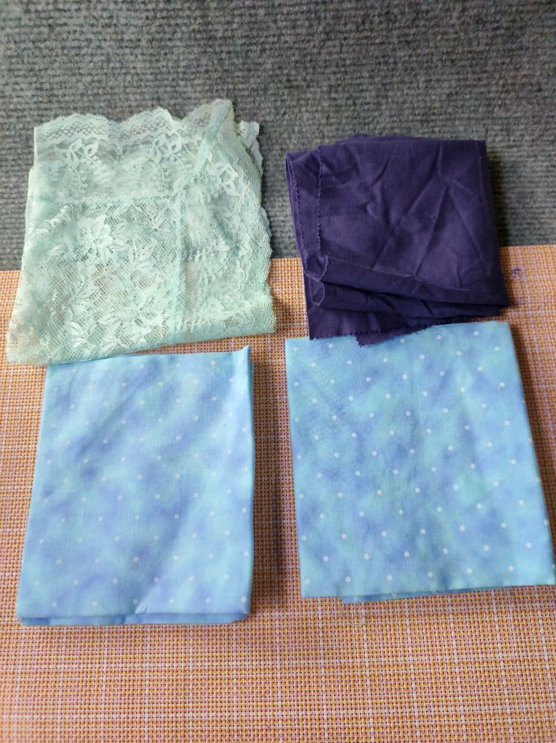Fabric scraps: Lace, Cotton prints, Solid purple (Category: Other Accessories) located in San Leonardo. Submitted by burgossanleonardo.12345 (Listing ID 1464181638, Image 1). Description: - Assorted fabric pieces perfect for your crafting needs. - Includes light blue cotton with white polka dots. - Solid dark purple fabric piece. - Delicate light green lace trim. - White lace overlay piece. - Ideal for sewing projects, quilting, or adding embelli