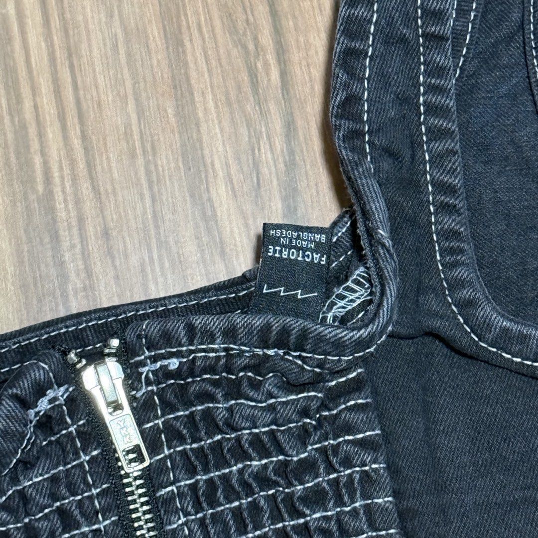 Factory Black Denim Corset Top with Zipper (Category: Sleeveless) located in Binangonan. Submitted by curatedbyjuys (Listing ID 1464351222, Image 3). Description: - Black denim corset top - Front zipper closure - White contrast stitching throughout - Strappy design - Estimated size: S or M - Ideal for going out or dressing up an outfit.