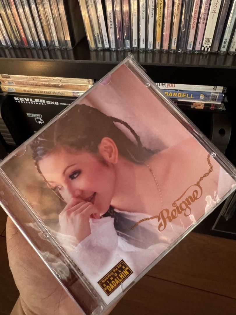 Fan Made Regine - Reine CD (Category: CDs & DVDs) located in Manila. Submitted by markdarwin18477 (Listing ID 1464140024, Image 1). Description: - Regine Velasquez's 'Reine' CD - Released in 2001 - Features 18 tracks - Includes the hit song 'Dadalhin' - Classic OPM album - Ideal for music collectors.