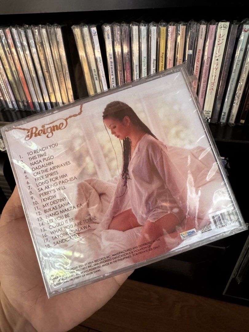 Fan Made Regine - Reine CD (Category: CDs & DVDs) located in Manila. Submitted by markdarwin18477 (Listing ID 1464140024, Image 2). Description: - Regine Velasquez's 'Reine' CD - Released in 2001 - Features 18 tracks - Includes the hit song 'Dadalhin' - Classic OPM album - Ideal for music collectors.