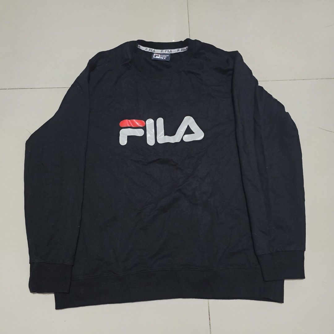 Fila White Line Black Sweatshirt (Category: Coats, Jackets and Outerwear) located in Quezon City. Submitted by kick_mnl (Listing ID 1464165357, Image 1). Description: - Classic black Fila sweatshirt - Features iconic Fila logo with white and red accents - Fila branded tape on the collar - Perfect for casual everyday wear - Approximately 24 inches in width.