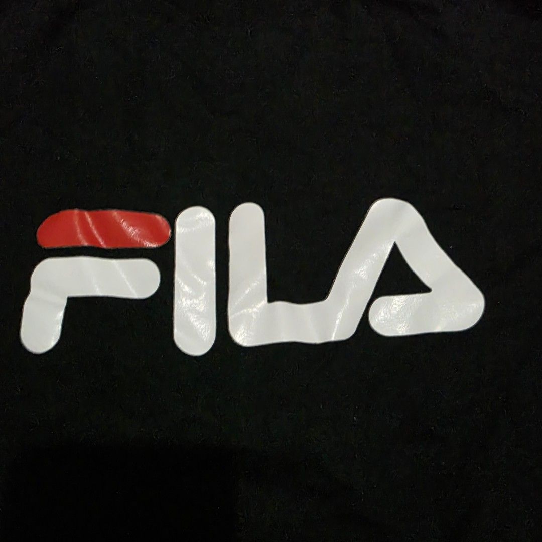 Fila White Line Black Sweatshirt (Category: Coats, Jackets and Outerwear) located in Quezon City. Submitted by kick_mnl (Listing ID 1464165357, Image 3). Description: - Classic black Fila sweatshirt - Features iconic Fila logo with white and red accents - Fila branded tape on the collar - Perfect for casual everyday wear - Approximately 24 inches in width.