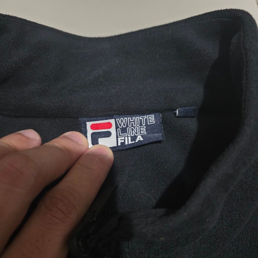 Fila White Line Fleece Zip-Up Jacket (Category: Coats, Jackets and Outerwear) located in Quezon City. Submitted by kick_mnl (Listing ID 1464167122, Image 3). Description: - Classic Fila fleece jacket - Full zip-up front with stand-up collar - Comfortable and simple design - Ideal for layering - Embroidered Fila logo on chest - Small Fila logo detail on zipper pull - Perfect for casual wear.