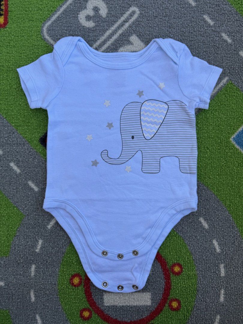 First Impressions Onesie (Category: Babies & Kids Fashion) located in Rizal. Submitted by preloovved (Listing ID 1464251317, Image 1). Description: - Preloved, 0-3mos - Adorable light blue baby onesie - Features a sweet elephant graphic - Striped details and scattered stars - Short sleeves for warmer days - Convenient snap closures at the bottom - Made with soft fabric for ultimate baby comfort - Perfect for everyday wear Meet-up only in GB1 San 