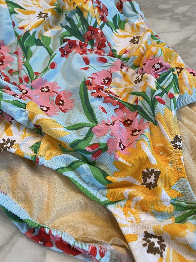 Floral 1 piece swimsuit (Category: Bikinis & Swimsuits) located in Makati City. Submitted by indaysukaycloset (Listing ID 1464194913, Image 2). Description: Floral One-Piece Swimsuit 🌼 Fits M to L Size on tag: 3L but fits M-L Color: Light blue with yellow & pink sunflower print With built-in padded cups + full lining inside Condition: Like new, no flaws M to L fit only - not XL.