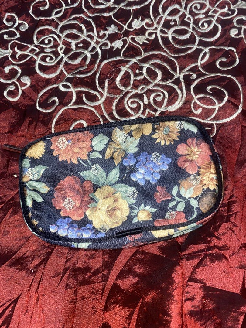 Floral Print Pouch Bag (Category: Purses & Pouches) located in Manila. Submitted by reginemarquez412 (Listing ID 1464232290, Image 2). Description: - Cute floral print pouch - Dark background with vibrant, colorful flowers - Secure zipper closure - Ideal for organizing small items like makeup or essentials - Fits easily into tote bags or larger purses.