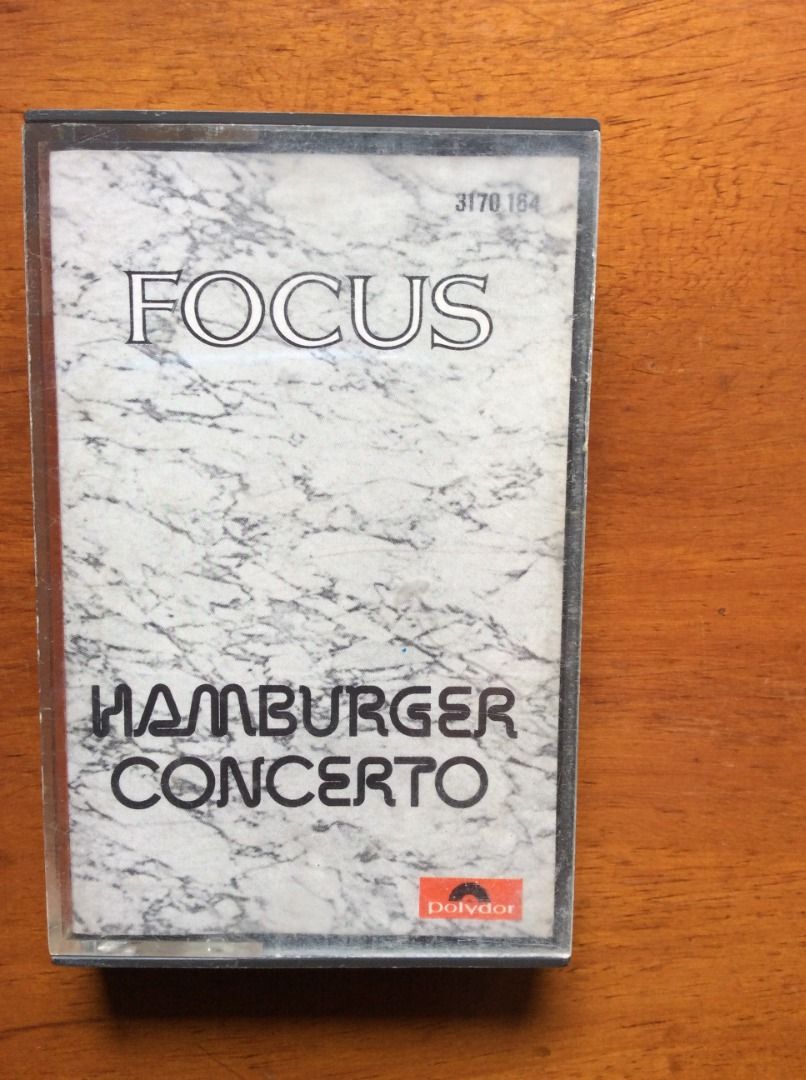 Focus Hamburger Concerto Polydor Cassette Tape (Category: CDs & DVDs) located in Silang. Submitted by lawrencenorthey (Listing ID 1464189823, Image 1). Description: - Focus Hamburger Concerto cassette tape - Polydor label - Released in 1974 - Includes tracks: Hamburger Concerto, Starter, Delitiae Musicae - Ideal for collectors and fans of the band.