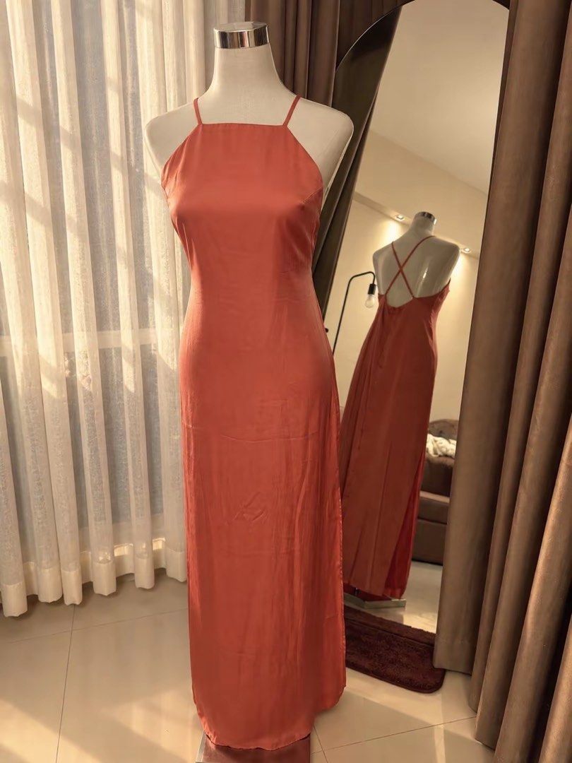 Forever 21 long satin dress (Category: Dresses) located in Makati City. Submitted by ksbsiisjnsos (Listing ID 1464237699, Image 1). Description: - Elegant coral satin maxi dress - Features a flattering halter neckline - Chic criss-cross back detail - Beautiful fabric sheen - Ideal for special events or a night out - Ankle-length with a comfortable, flowy fit.
